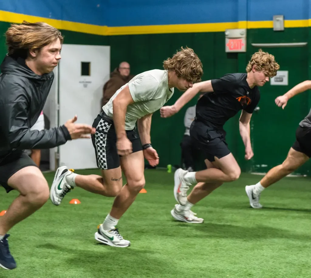 teenage boys running drills for sports training program in metro east